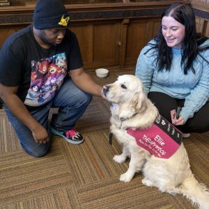 Students with Ellie a therapy dog